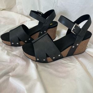 Volatile black leather wedge shoes